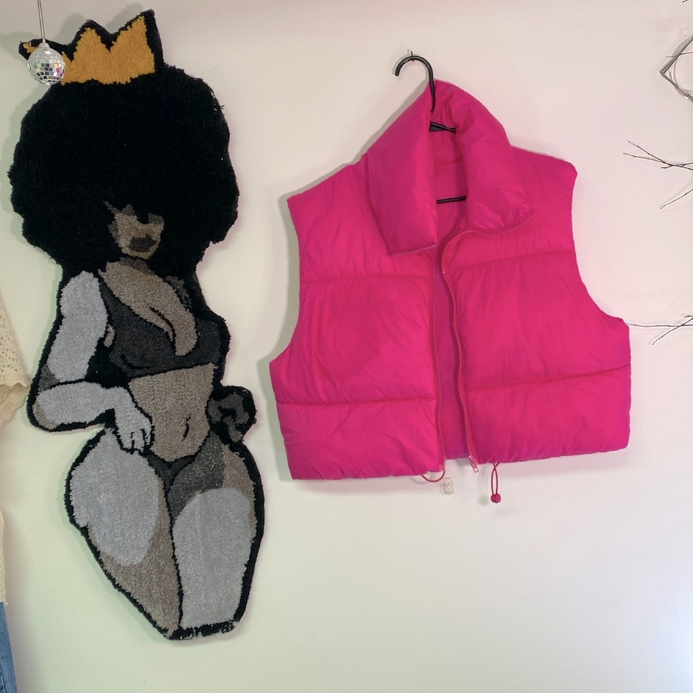Cropped puffer vest with hat.